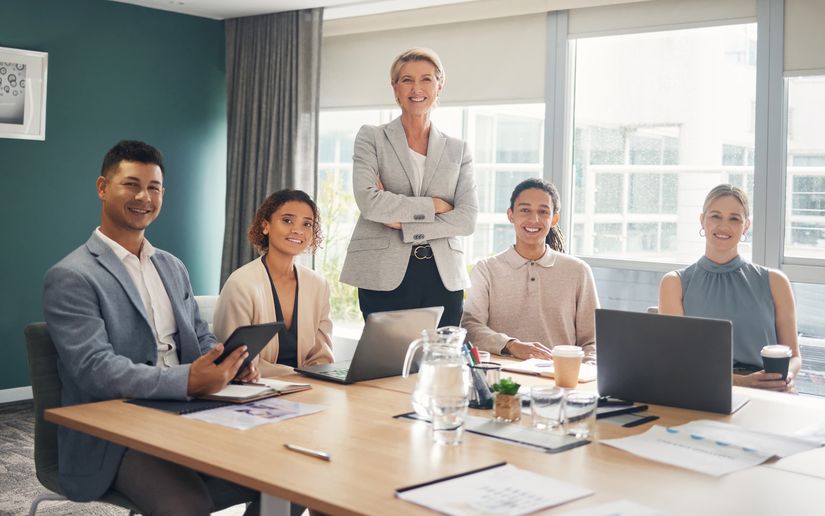 A diverse team of education professionals gathered in a meeting room